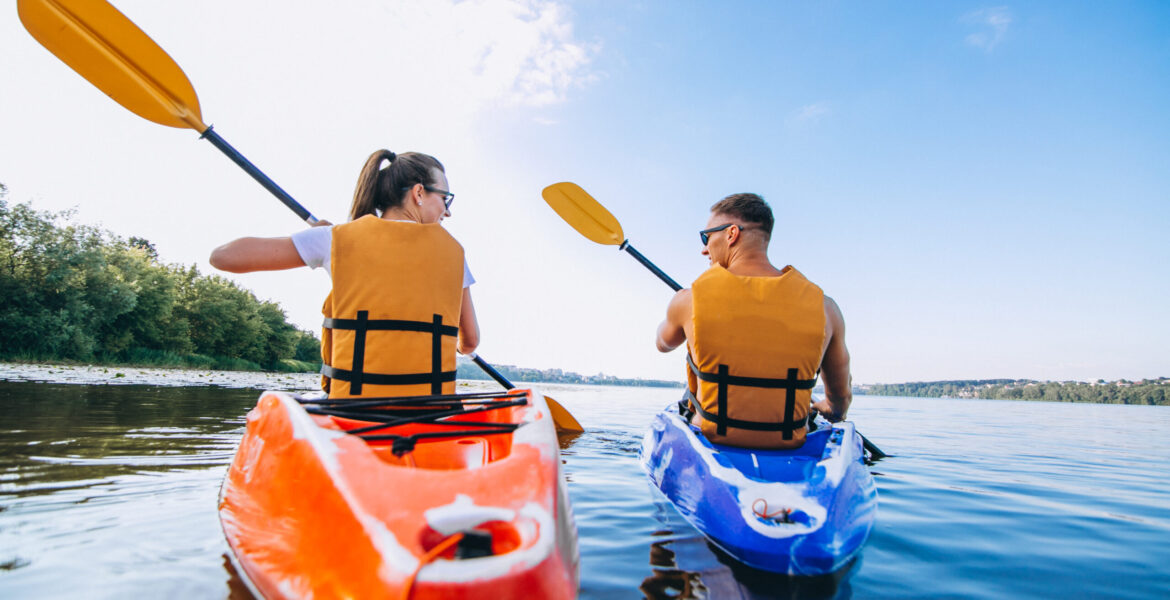 Couple together kayaking on the river